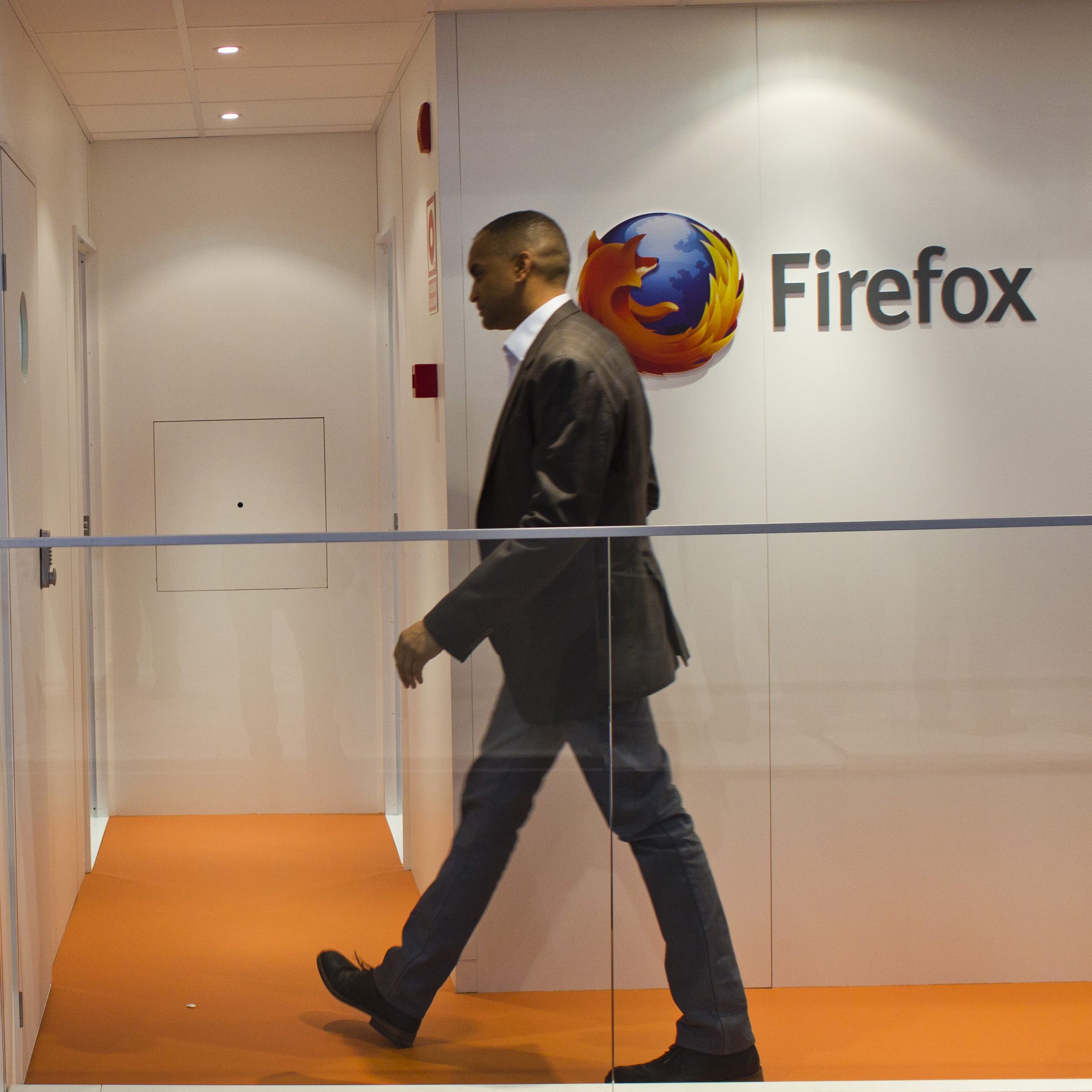 A visitor enters the Firefox pavilion at the Mobile World Congress in Barcelona, Spain, on Tuesday, Feb. 26, 2013. The Mobile World Congress, where 1,500 exhibitors converge to discuss the future of wireless communication, is a global showcase for the mobile technology industry and runs from Feb. 25 through Feb. 28. Photographer: Angel Navarrete/Bloomberg via Getty Images