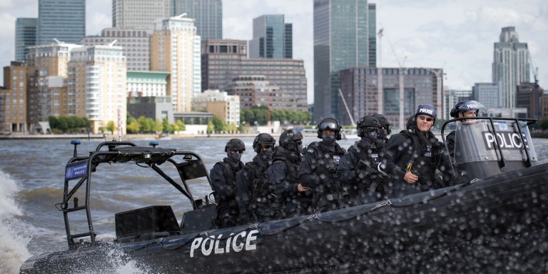 Armed Metropolitan Police counter terrorism officers take part in an exercise on the River Thames in London, Wednesday Aug. 3, 2016. London's police force is putting more armed officers on the streets 'to protect against the threat of terrorism.'' The increase in the number of officers follows attacks in France, Belgium and Germany. (Stefan Rousseau/Pool Photo via AP)